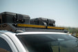 Roof Rack Light Mount for the 4th Gen Toyota Tacoma Roof Rack with storage boxes, with a blurred background