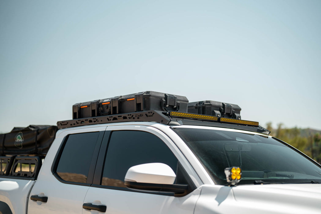 Roof Rack Light Mount for the 4th Gen Toyota Tacoma Roof Rack with storage boxes against a clear sky