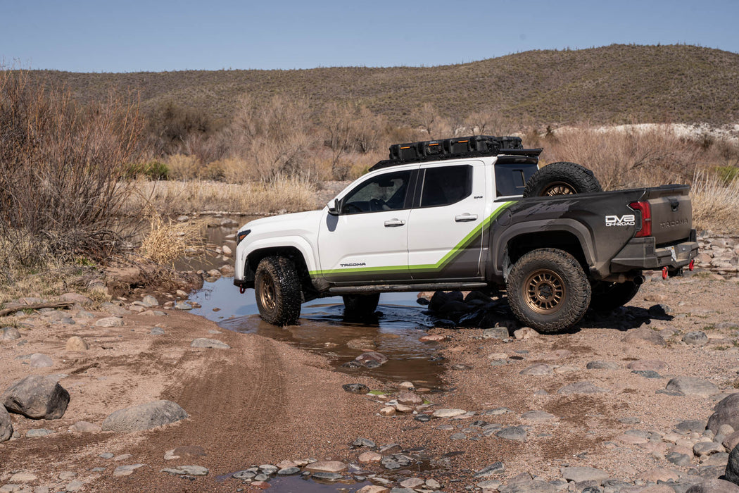 DV8 Offroad Tacoma beginning river crossing.