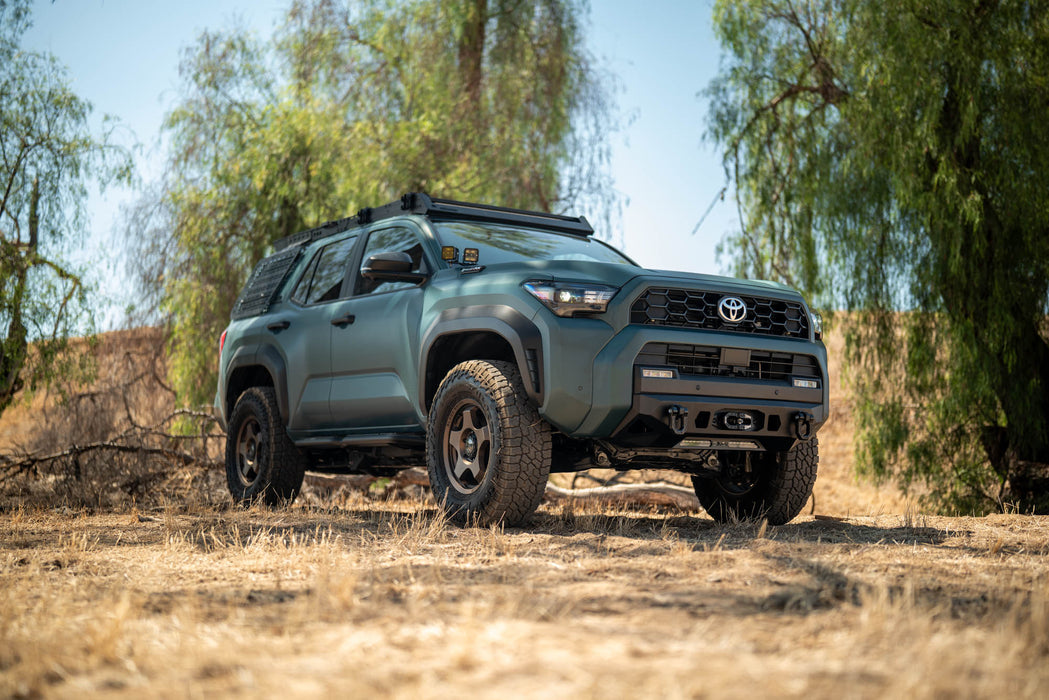 6th Gen Toyota 4Runner Centric Winch Front Bumper in a natural setting with trees and clear sky