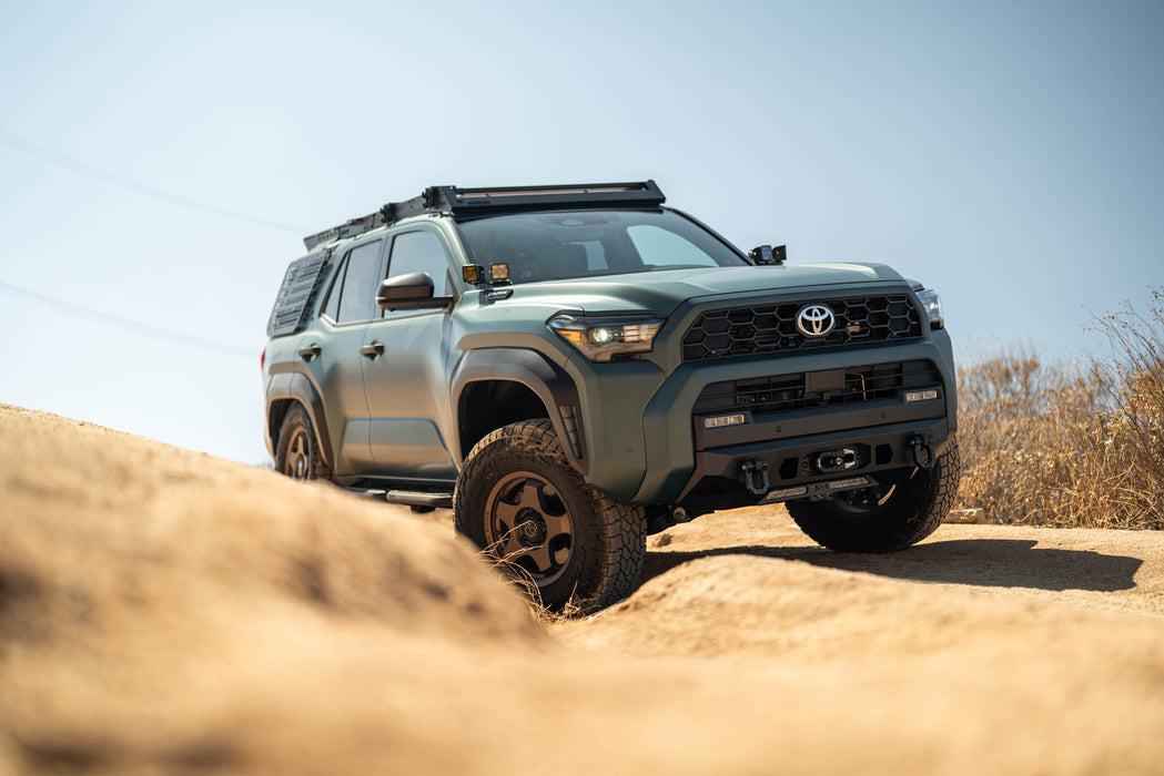 6th Gen Toyota 4Runner Centric Winch Front Bumper, on a dirt road with clear sky