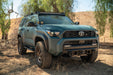 6th Gen Toyota 4Runner Centric Winch Front Bumper, in a desert setting with trees in the background