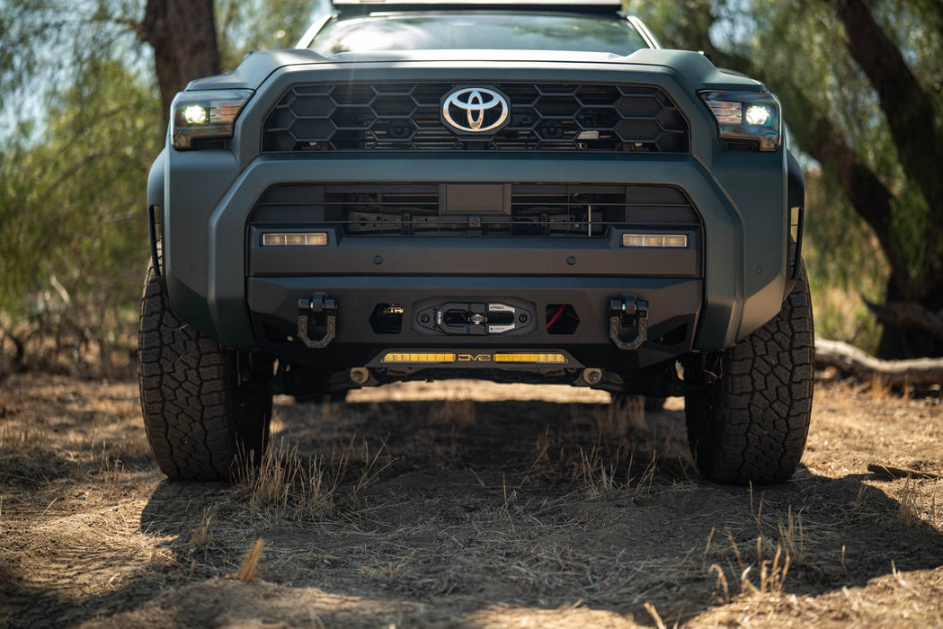 Front view of a 6th Gen Toyota 4Runner Centric Winch Front Bumper in a natural setting