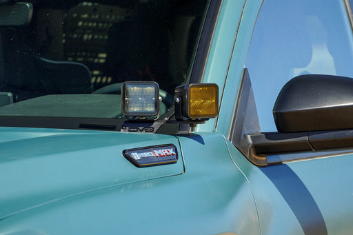 6th Gen Toyota 4Runner Ditch Light Brackets installed with clear and amber light pods.