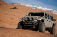 Jeep Gladiator on a rock-crawling trail with mountains in the background