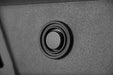 A DV8 Sensor Bezel replacing the OEM sensor bezel in an aftermarket bumper.
