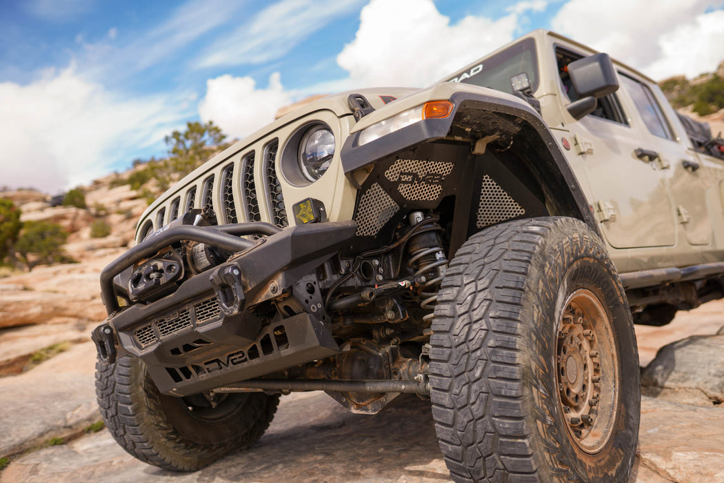 Off-road Jeep Gladiator Build on rocky terrain with a clear sky