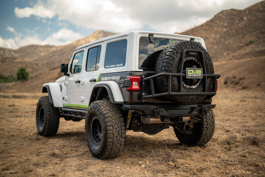 White Jeep Wrangler with 2018-2025 Jeep Wrangler JL Body Mounted Tire Carrier in a desert landscape