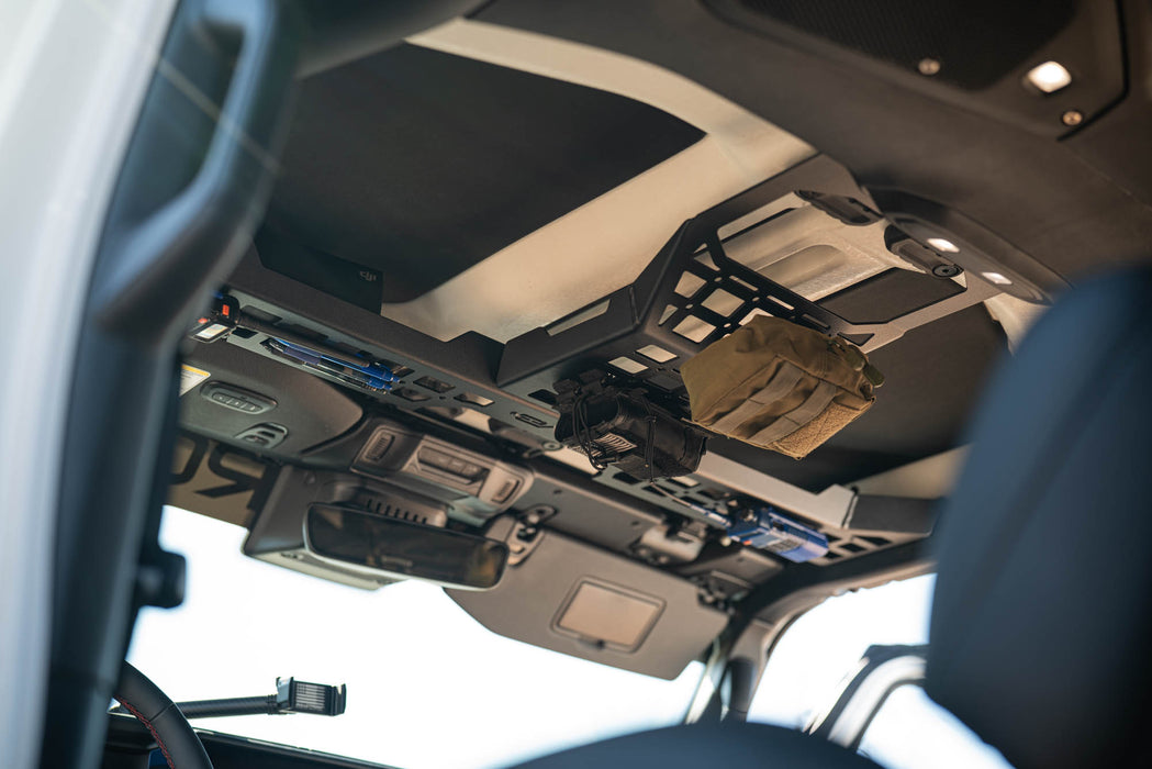 An installed Jeep Wrangler & Gladiator Overhead Molle Panel with molle pouches attached