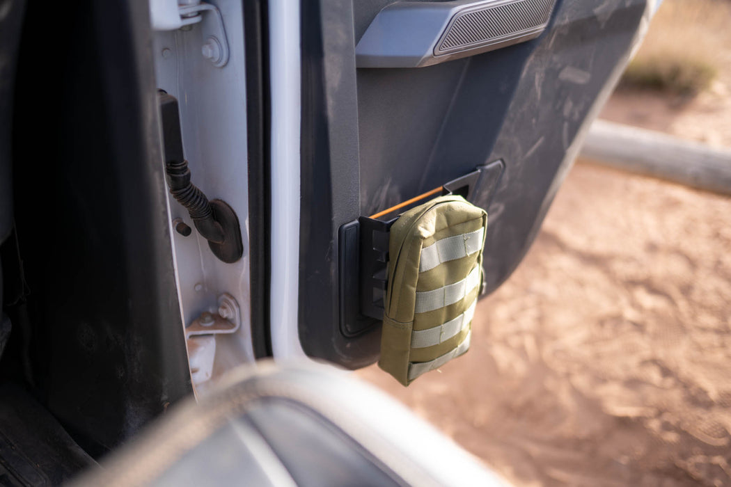 Bronco rear door molle panel with molle bag on the door.