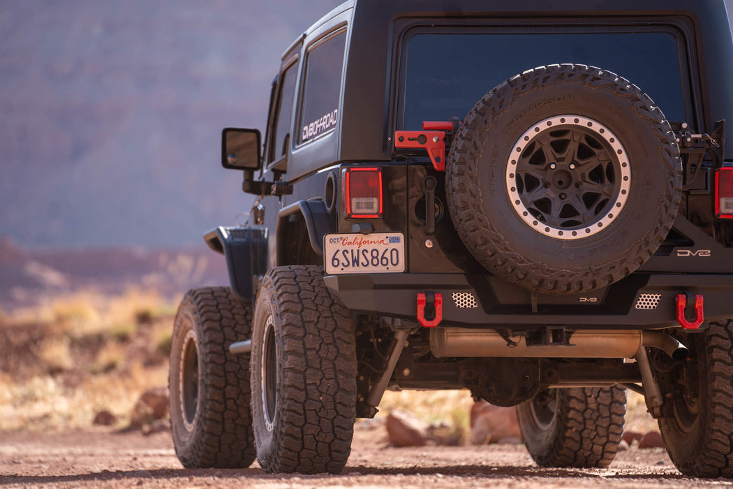 Jeep Wrangler JK in a desert setting with mountains in the background
