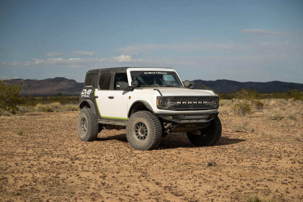 White Bronco with off road parts in a desert landscape